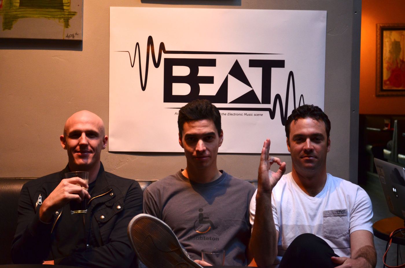 John, Dan and host Charlie seated together in front of the BEAT banner